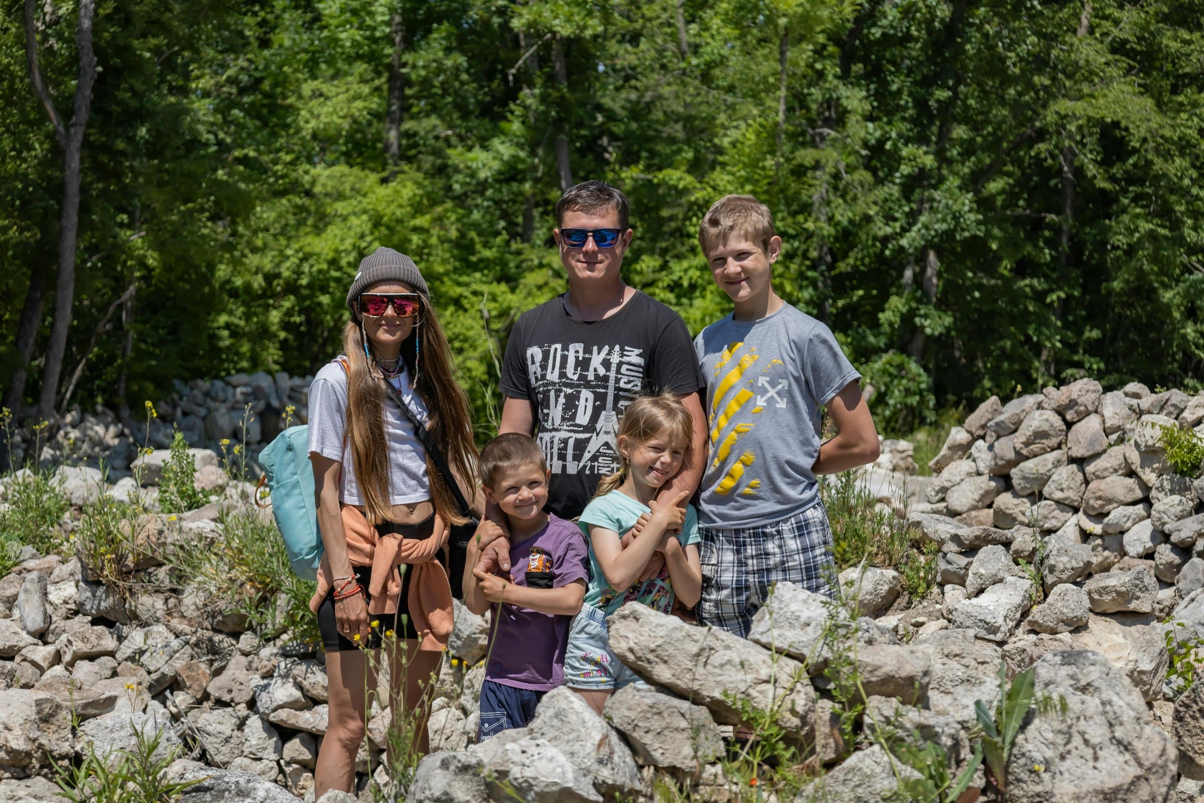 A family group of five travelers enjoying an outdoor Vietnam tour together.
